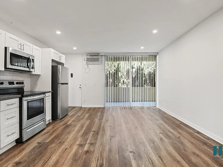 Open-Concept Kitchen, Dining, and Living Room Areas with Large-Size Windows