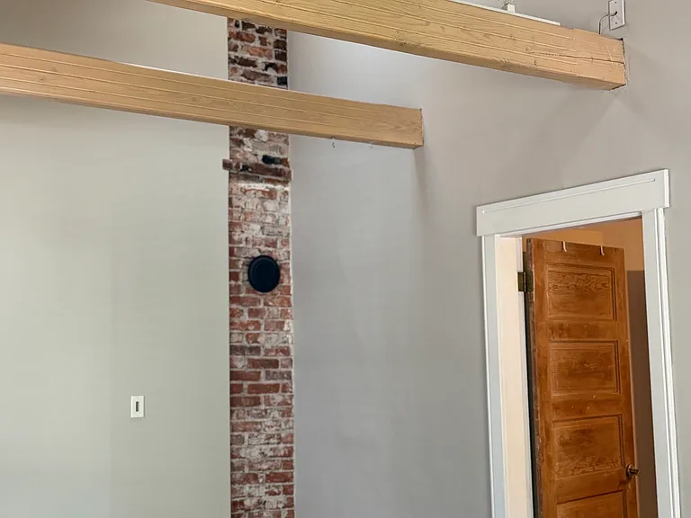 living room with high ceiling, high beams, overhead lighting, 2 skylights-open/close for air circulation