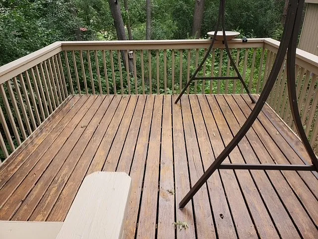 Deck off of dining room in private backyard setting