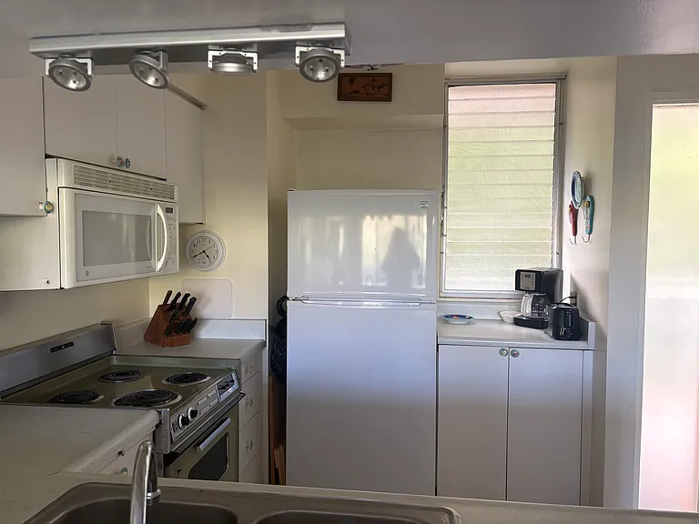 The kitchen is clean and spacious with windows that open to provide a view and nice ventilation.