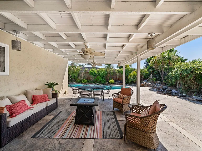 Covered patio overlooking the pool & fountain/pond