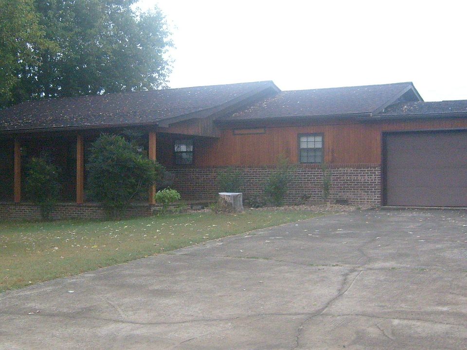 front of house with 2-car attached garage with remote control openers