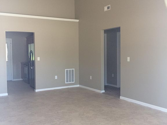 Living room with vaulted ceiling & tile