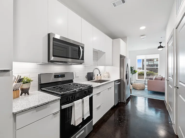 Studio Kitchen with Stainless Steel Applainces and Gas Stove Top