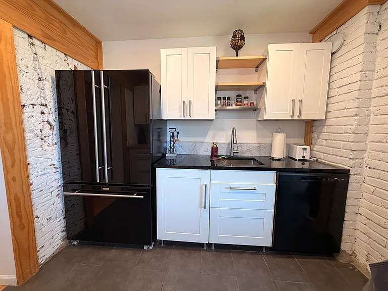 Kitchen with basic dishes/pots/pans/glassware.