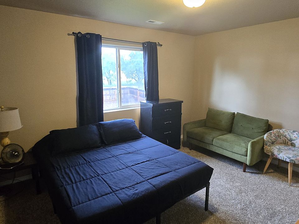 Available room- 11' x 13'. Window faces the north & overlooks the backyard, pretty trees, and a large field/old ranch, with Pikes Peak to the West.