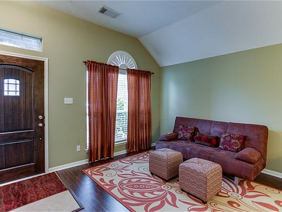 Upgraded front door (2012) entry to flexible living room space