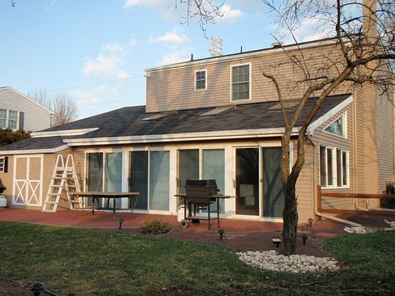 Storage building on left, large Family Room shown on right