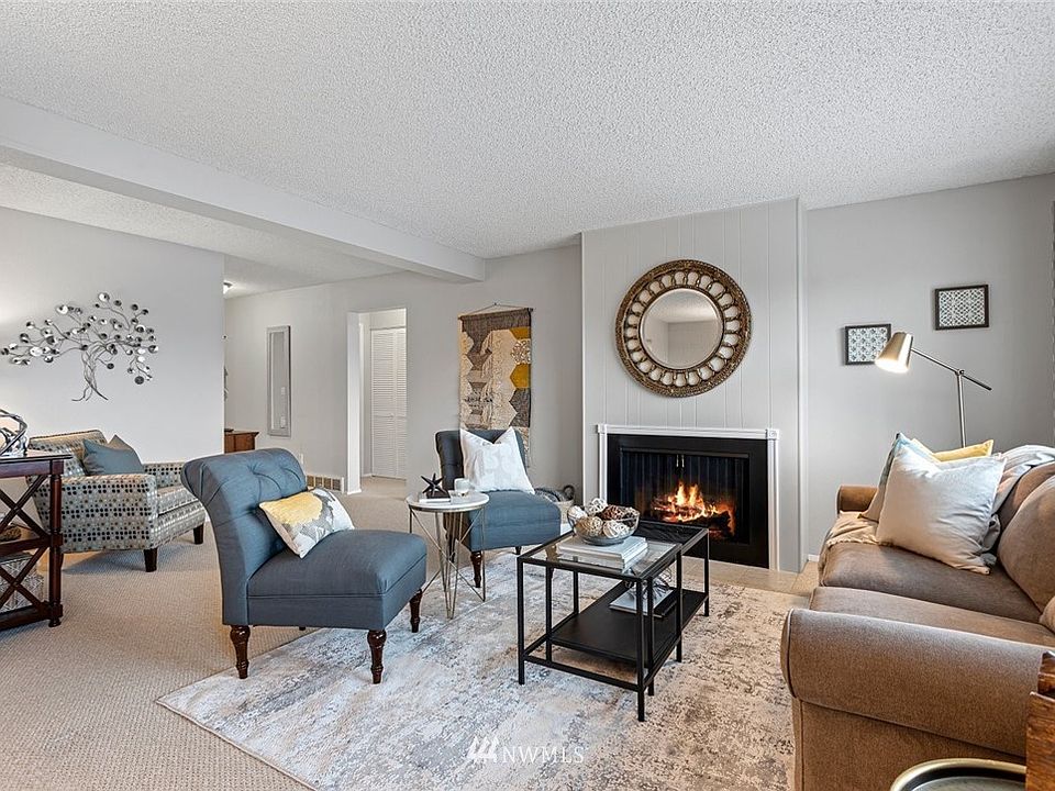 Large living room features a gas fireplace.