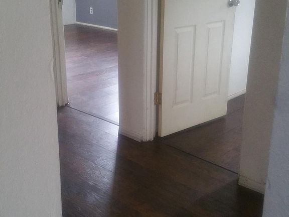 Hallway, entrance to two of three bedrooms