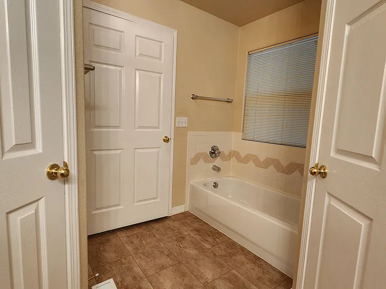 Master Bathroom - Walk-In Closet Door on Left, Door to Toilet on Right