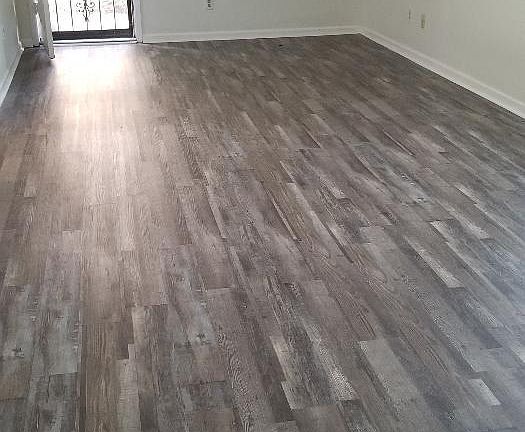New vinyl plank flooring in living areas