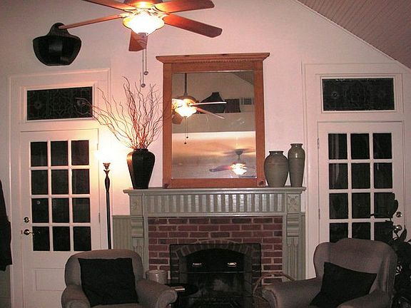 Family room addition on rear of home has new working masonry fireplace, three french doord to courtyard, built-ins and more
