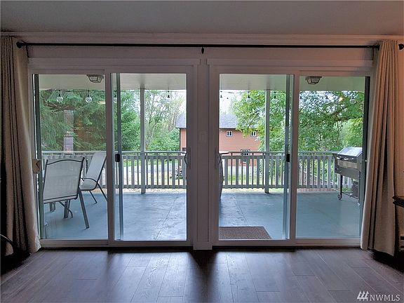 Double Slinging doors lead to the Deck from the Living Room