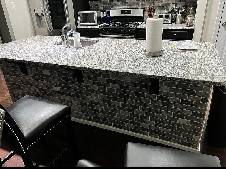 Upgraded kitchen island with backsplash