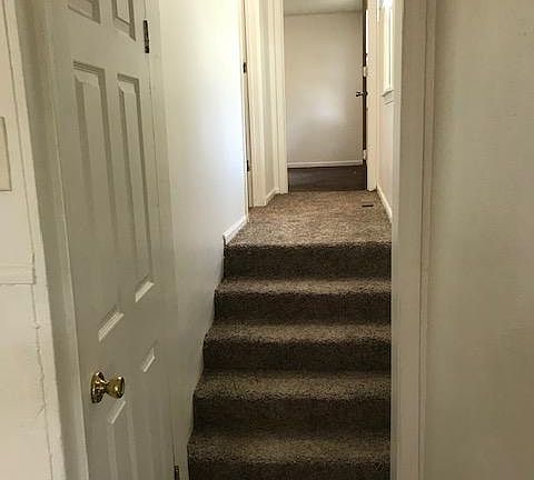 steps and hallway to bedrooms