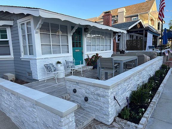 New front patio with fire table and comfortable seating with outdoor dining.