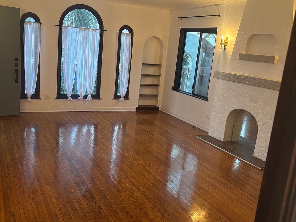 Gleaming original hardwood floors in living room