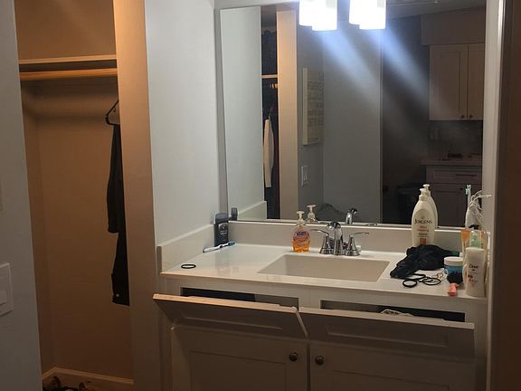 Bathroom sink area w/ right-side close space view