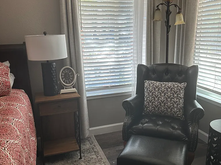 2 nice size windows w/2" faux wood blinds, semi-sheer as well as dark-out curtains. 1 window overlooks the courts and the other green space outside room.
Room fully furnished with/ nite-stands, quality lamps and chairs;