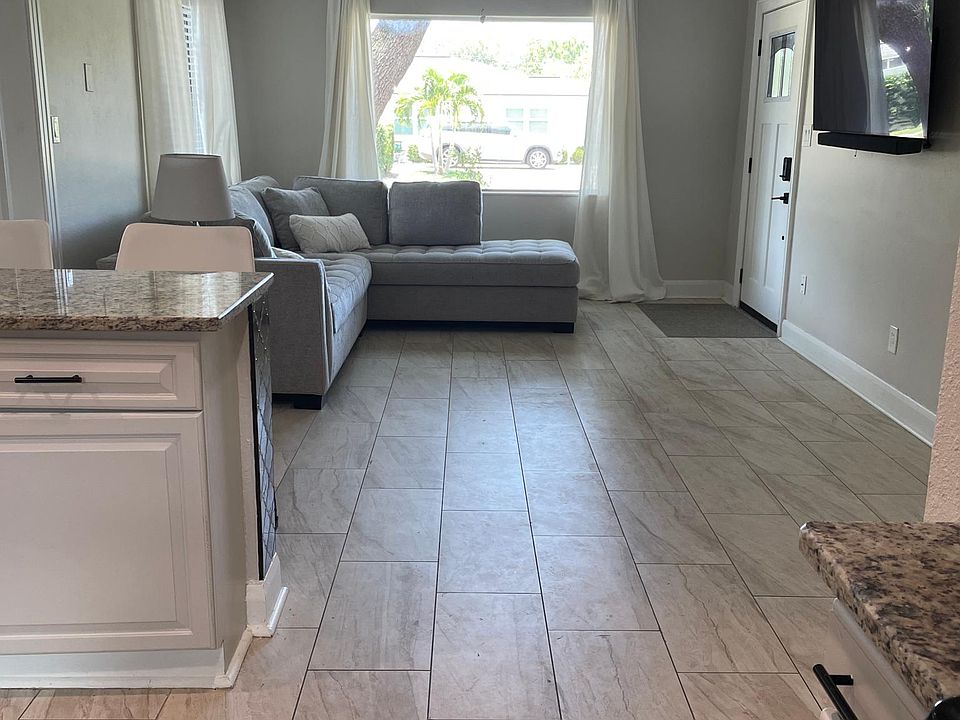Large open space from kitchen to family room to enjoy shared company and view of television with a large 4k screen and surround sound