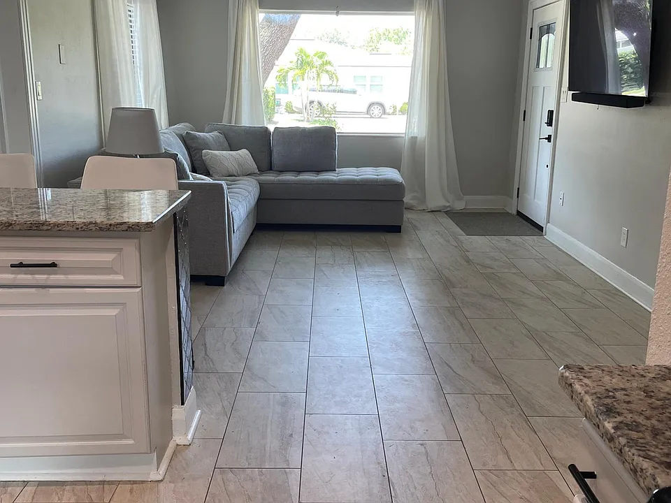 Large open space from kitchen to family room to enjoy shared company and view of television with a large 4k screen and surround sound