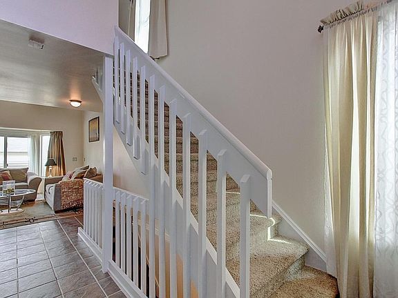Entry to living room; stairs up to 2nd floor bedroom