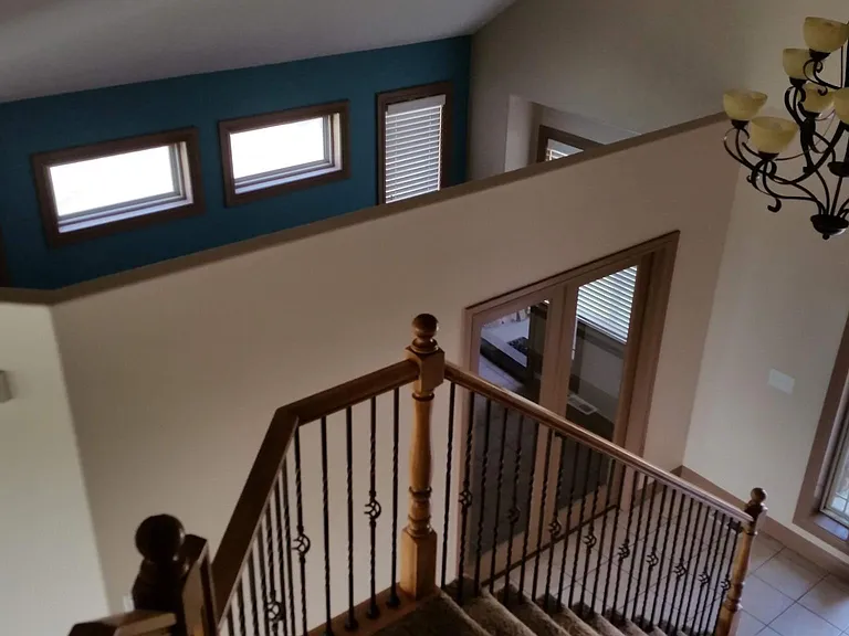View of front entry from stairs (music/office room)
