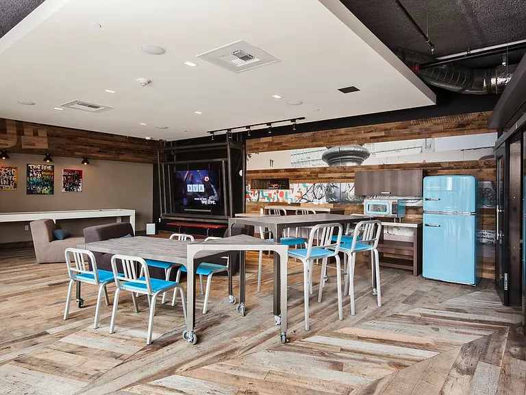 Chill lounge with entertaining kitchen, flat screen televisions and common area seating