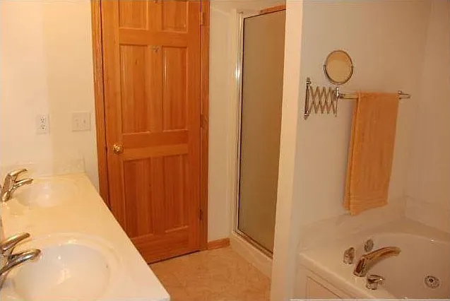 Master Bath with standing shower and two vanity