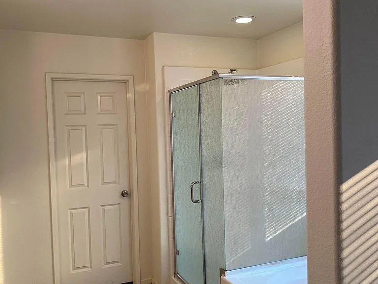 Master Bathroom #2 features a separate shower and bathtub, a vanity mirror, and dual sinks.