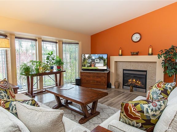 Living Room with Warm Color Scheme Invites.