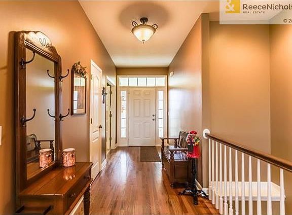 GRAND ENTRANCE LOOKING OUT TO BACK DECK AND PASTURE!