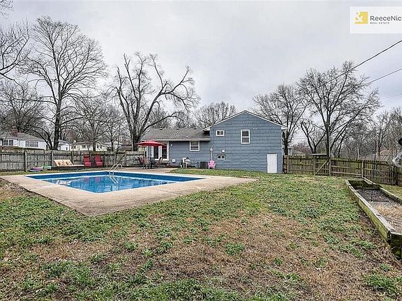 Not only an in-ground pool, but also a large backyard with lots of green space and raised garden beds. Basement walkout is door to garage.