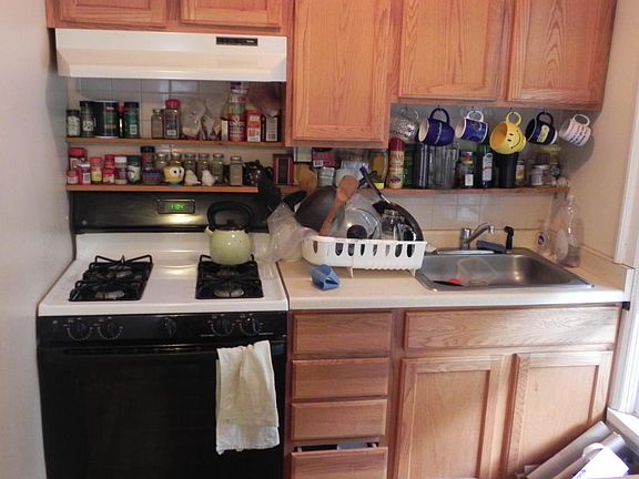 Kitchen cabinets, gas stove & sink