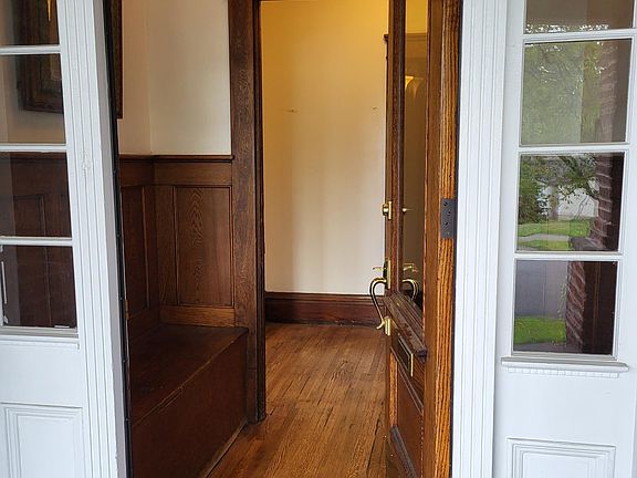 Foyer with bench seat and storage