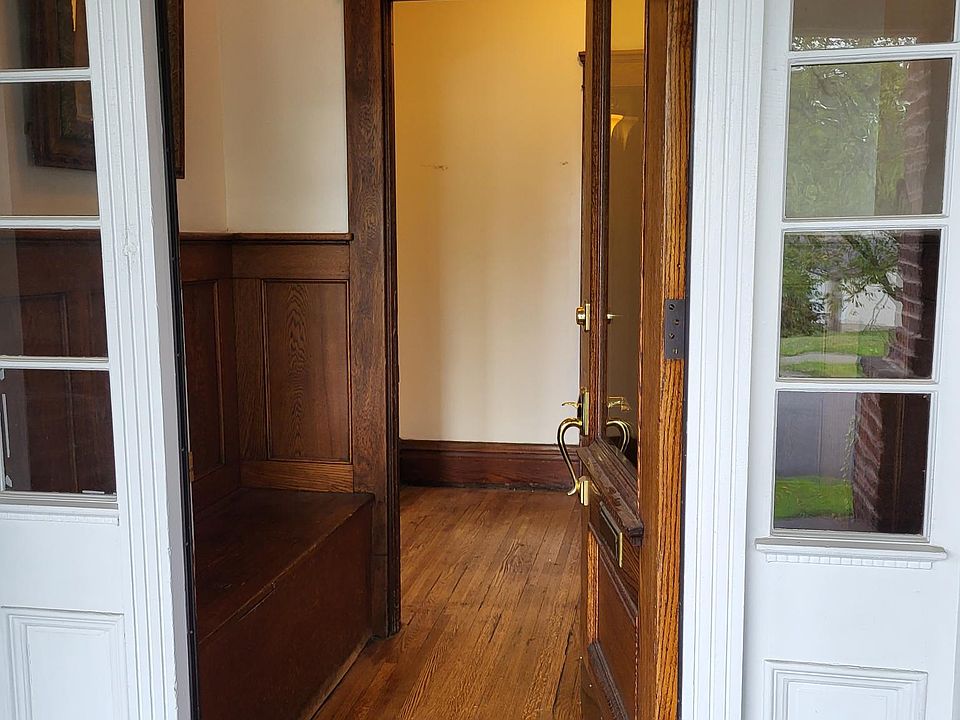 Foyer with bench seat and storage
