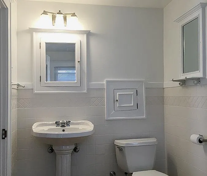 Bathroom is now all white with a brand new B&W miniature hex tile floor pattern / old fashioned black daisy pattern. Original tub shower with new tile surround. Updated photos to come. A laundry shoot to the basement!!
