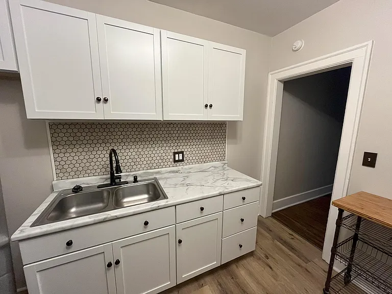 All new cabinets, counter, hardware, tile backsplash, easy-to-clean vinyl floors.