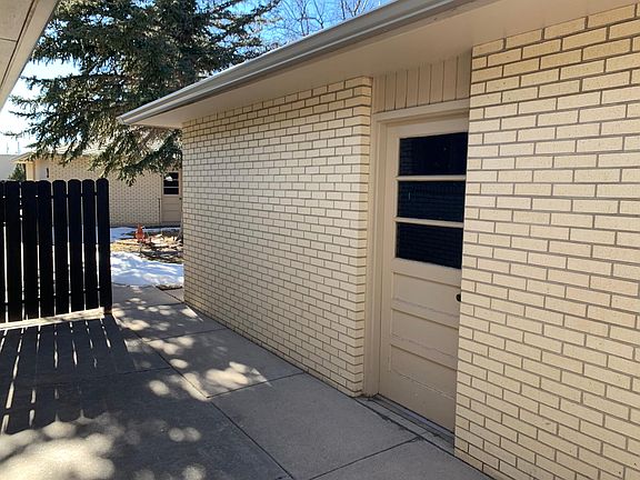 Back patio leading to detached garage