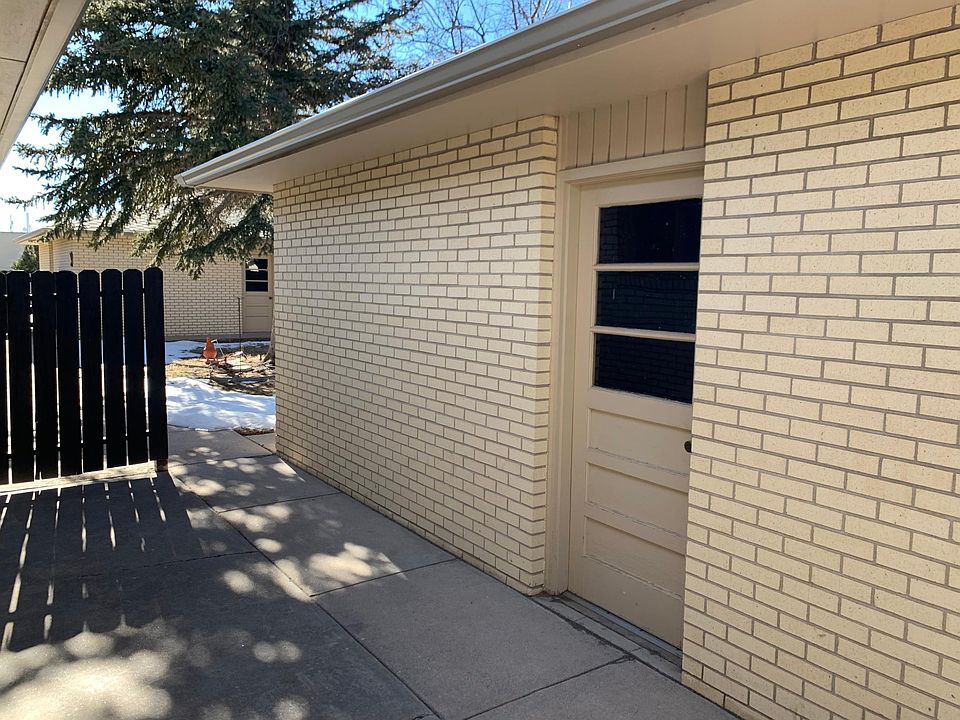 Back patio leading to detached garage