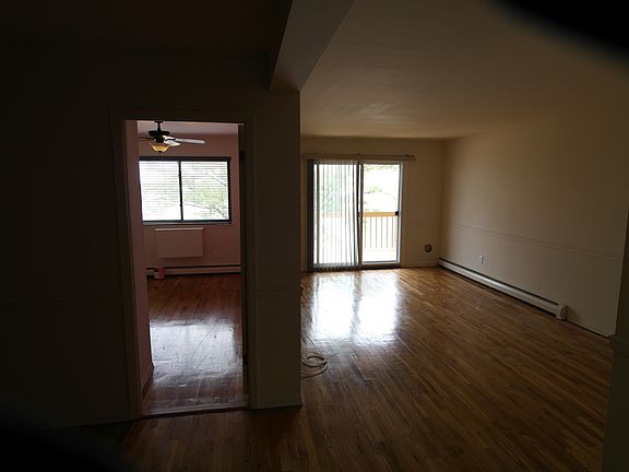 Living room leading to waterfront balcony