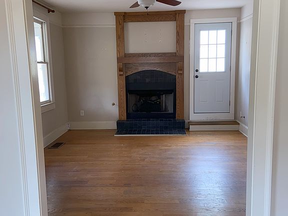View from dining room to living room and back rooftop patio door.