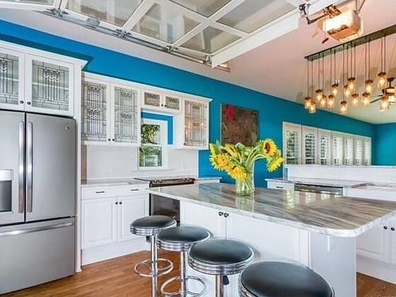 Custom stained glass cabinets, marble counters and stainless