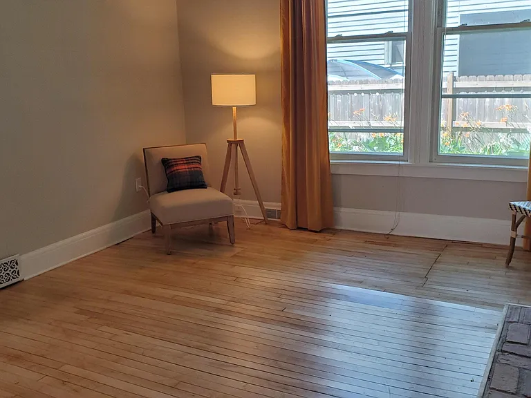 A couch fits well along this wall, even a sectional.