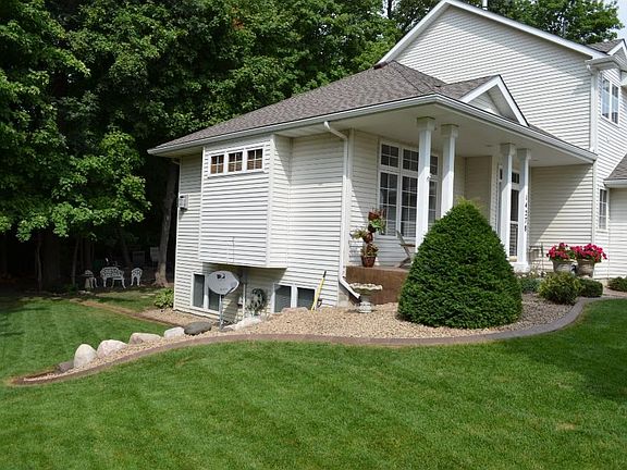 It's almost summer! You'll love the treed backyard! Professional, upgraded landscaping with concrete edging is a standout.