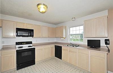 Kitchen opens to family room with wood burning fireplace. All appliances are included!!