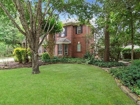 The home is surround by lush landscaping and stately mature trees!