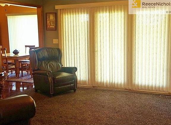 New carpet and paint makes this large living room ready for your cozy furniture.