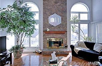 2 Story greatroom with brick to ceiling fireplace.